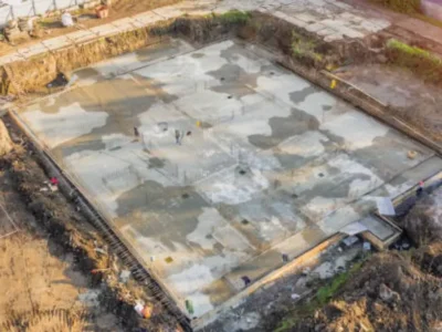 Commercial concrete foundation slab under construction at large job site