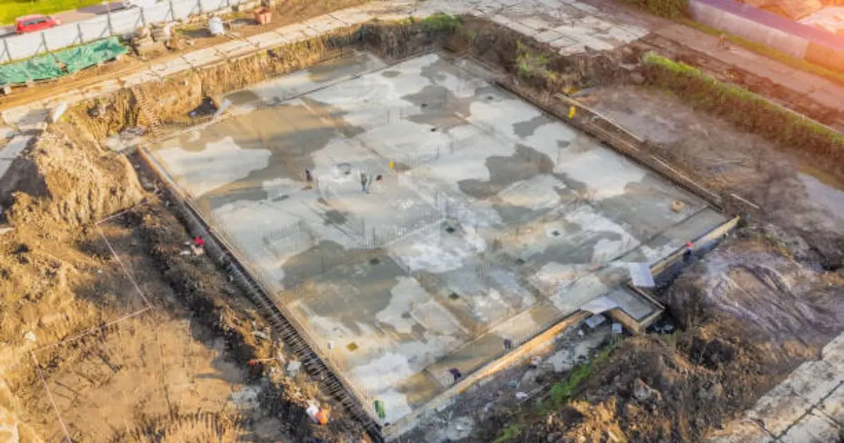 Commercial concrete foundation slab under construction at large job site