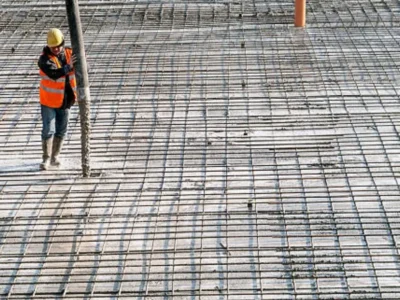 Large-scale commercial concrete pour with pump truck and crew
