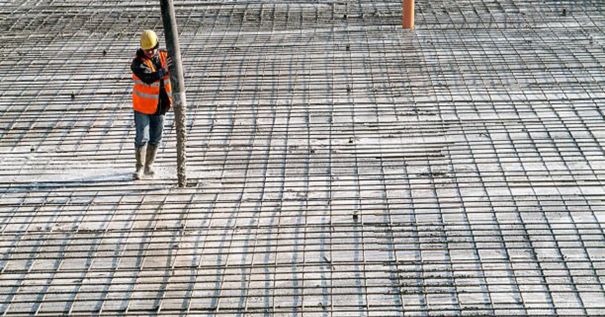 Large-scale commercial concrete pour with pump truck and crew