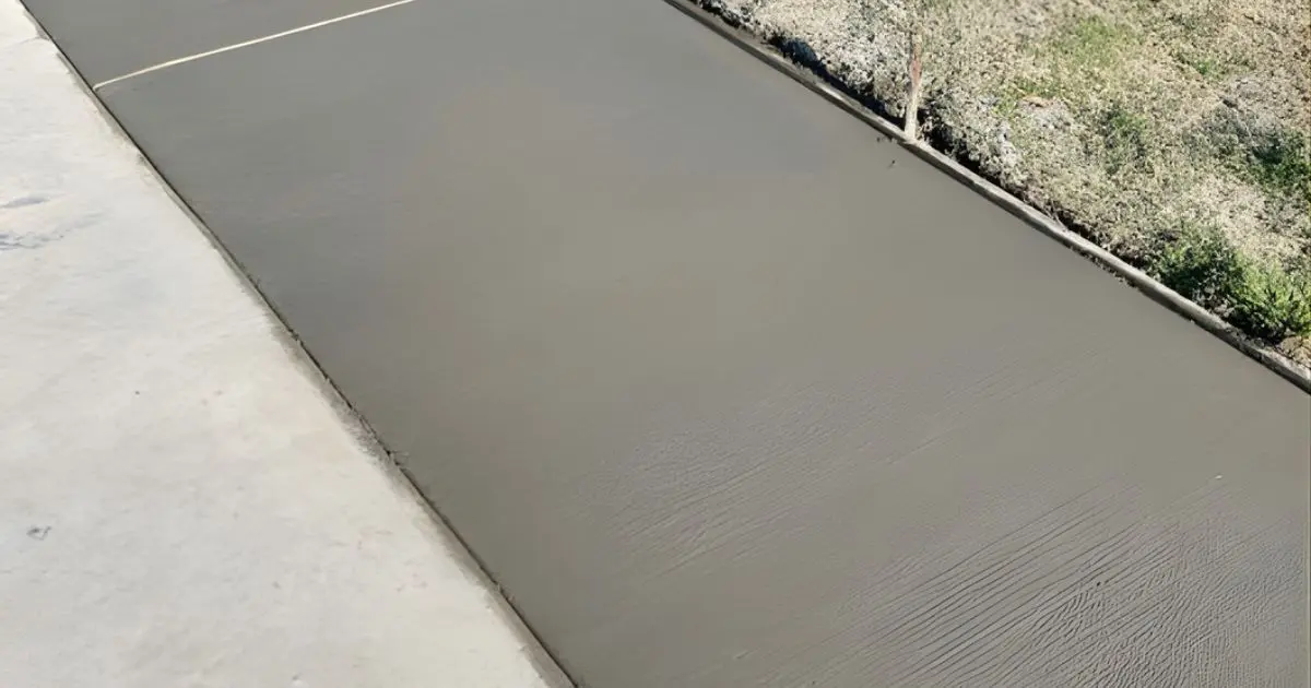 Concrete apron connecting driveway to public sidewalk at street