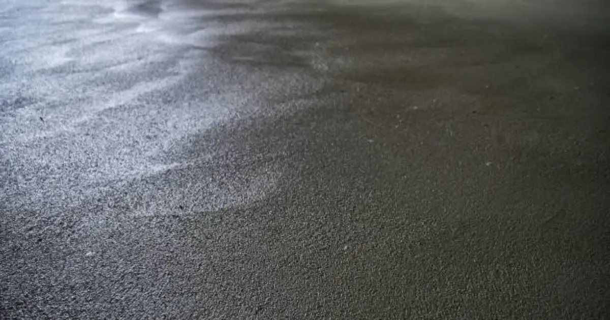 Fresh concrete surface with moisture sheen before final set