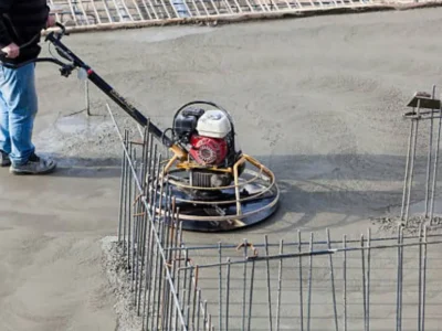 Power trowel machine finishing large commercial concrete floor