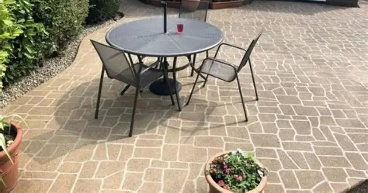Stenciled decorative concrete patio with tile pattern and color accents
