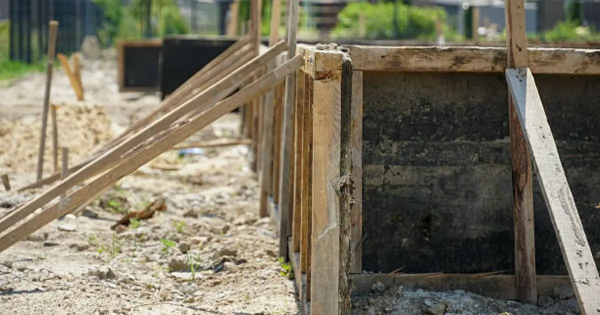 Wooden concrete formwork boards set up and braced for foundation pour